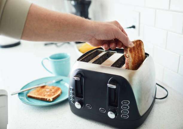 man making toast for toaster