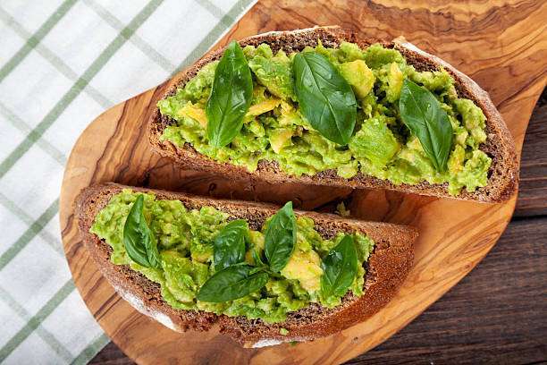 Healthy avocado sandwich, toast bread. Toaster