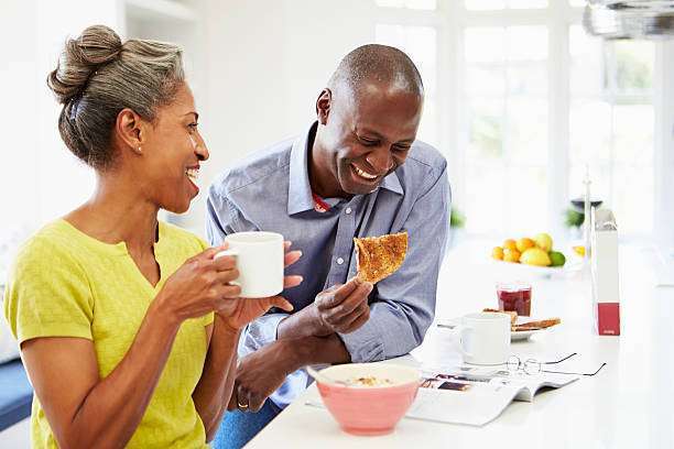 African American Couple Having Breakfast And toaster