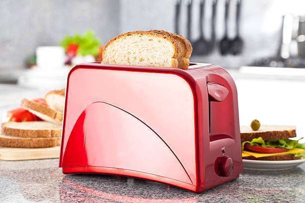 Red Toaster on Modern Kitchen Counter Top.
