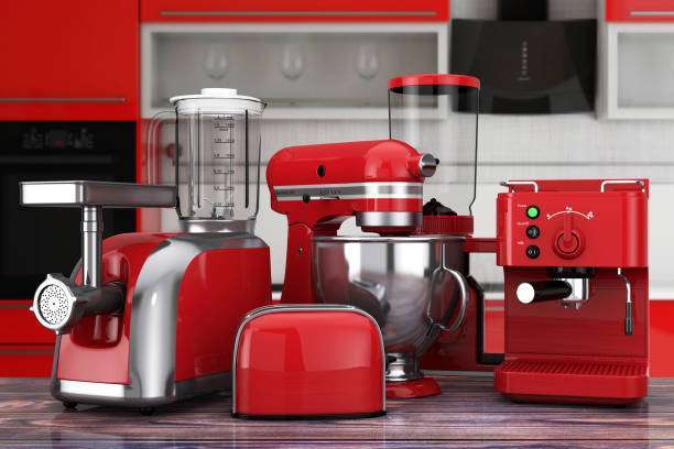 Set of matching red kitchen appliances, including a sleek toaster, blender, and coffee maker.