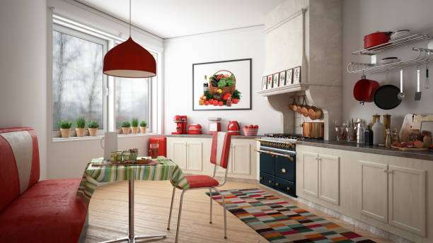 Spacious, bright kitchen with red accents and dining nook, ideal for a morning toaster.