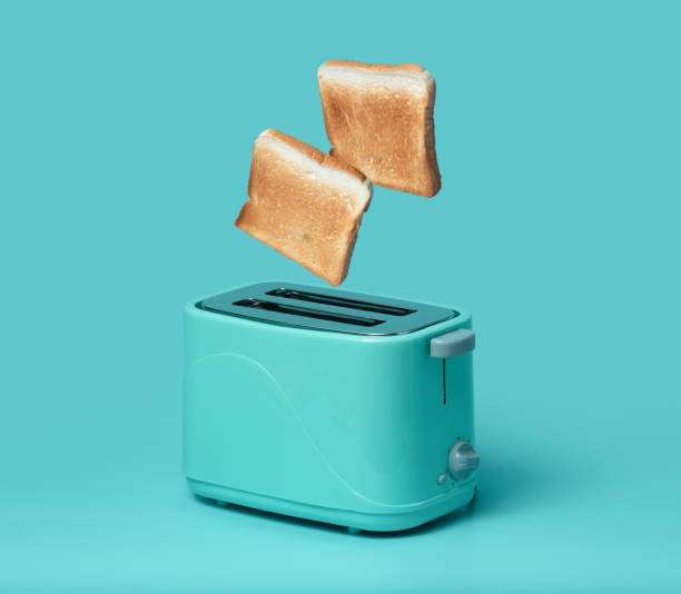 Two pieces of toast pop out of a turquoise toaster.